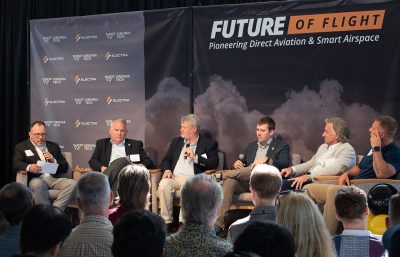 From left: Virginia Tech Mid-Atlantic Aviation Partnership Director Tombo Jones speaking on the Future of Flight Panel alongside Virginia Department of Aviation Director Greg Campbell, Virginia Department of Aviation Advanced Air Mobility Program Manager Scott Denny, Electra Senior Vice President for Product Development JP Stewart, Surf Air Mobility COO for Airline Operations Louis Saint-Cyr, and NAVOS Air Chief Procedure Designer Ty Le Roy. 
